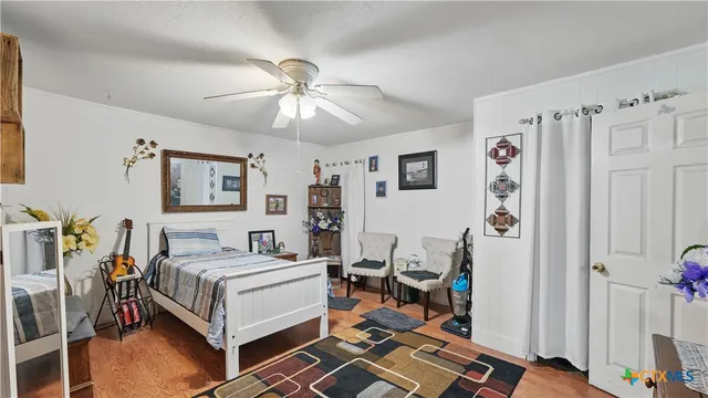 a view of a patio with chairs and wooden floor