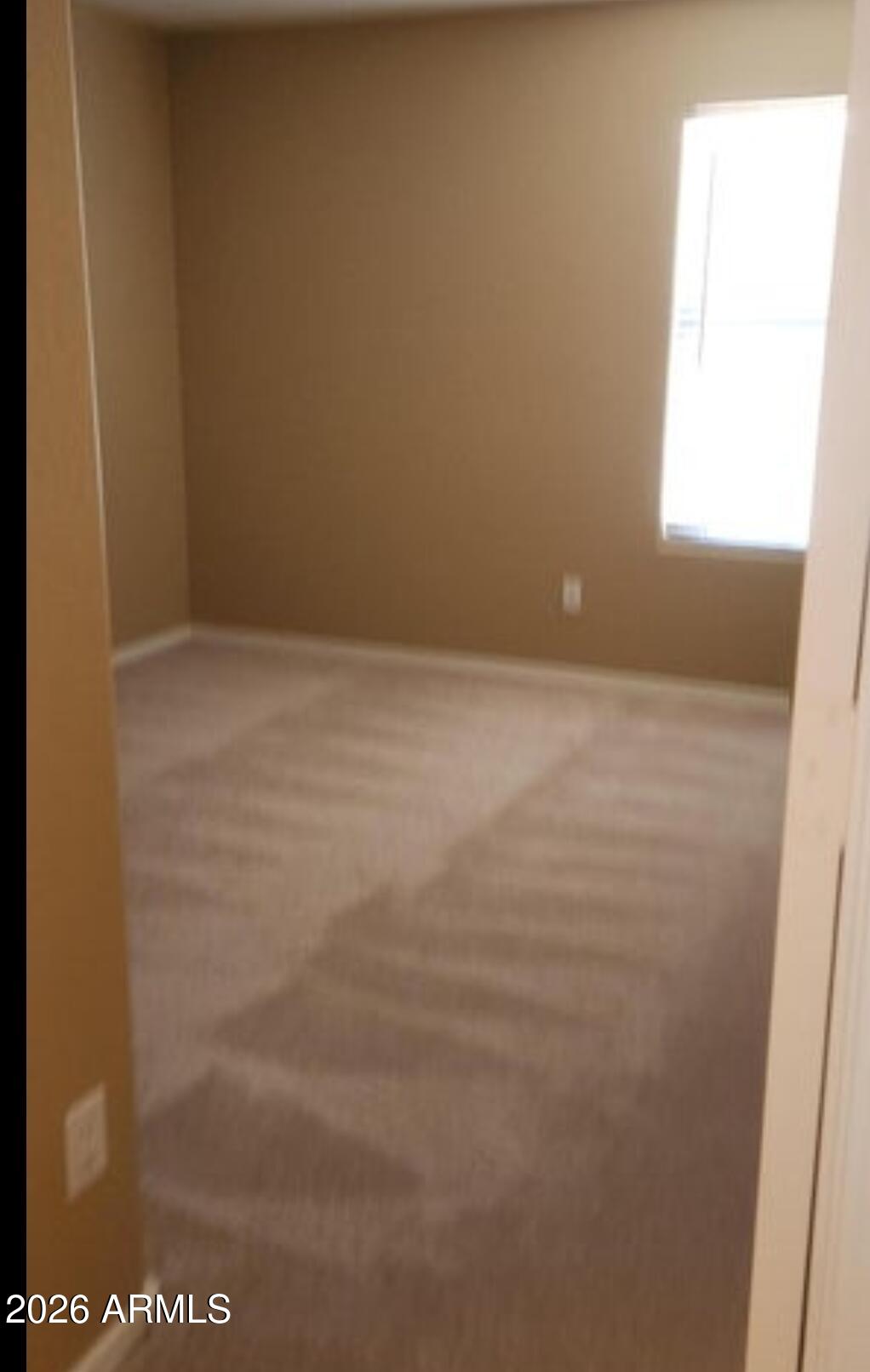 2134 West Pleasant Lane Phoenix, AZ 85041 - Photo 12 of 23 a view of an empty room and window