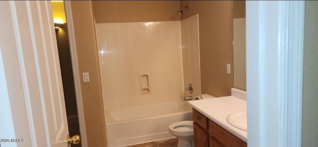 2134 West Pleasant Lane Phoenix, AZ 85041 - Photo 13 of 23 a bathroom with a granite countertop sink toilet and shower