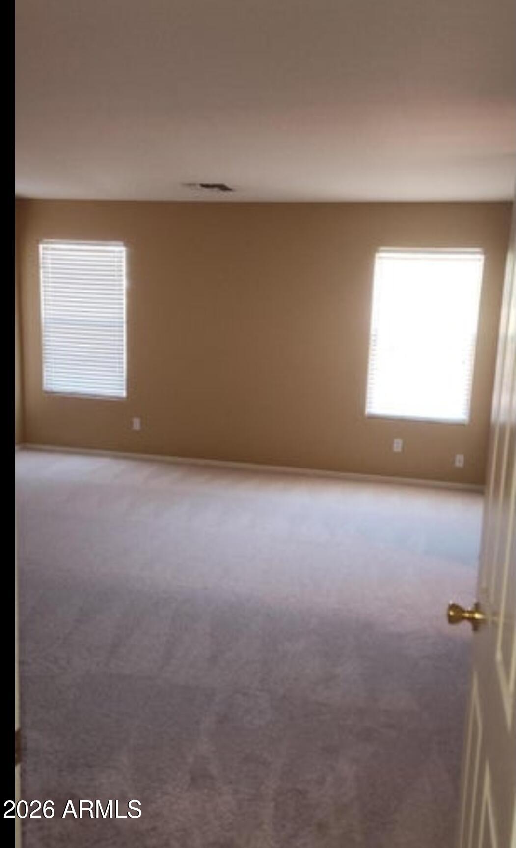 2134 West Pleasant Lane Phoenix, AZ 85041 - Photo 14 of 23 a view of an empty room with a window