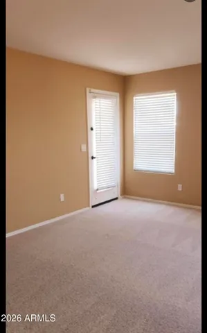 a view of closet with wooden floor