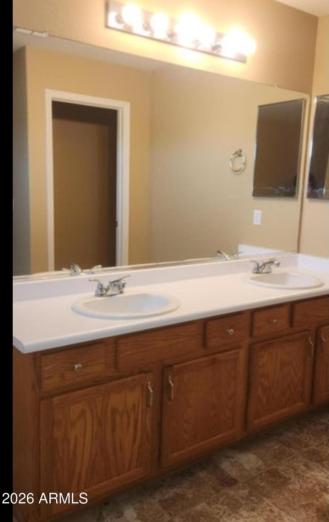 2134 West Pleasant Lane Phoenix, AZ 85041 - Photo 18 of 23 a bathroom with a sink and a mirror