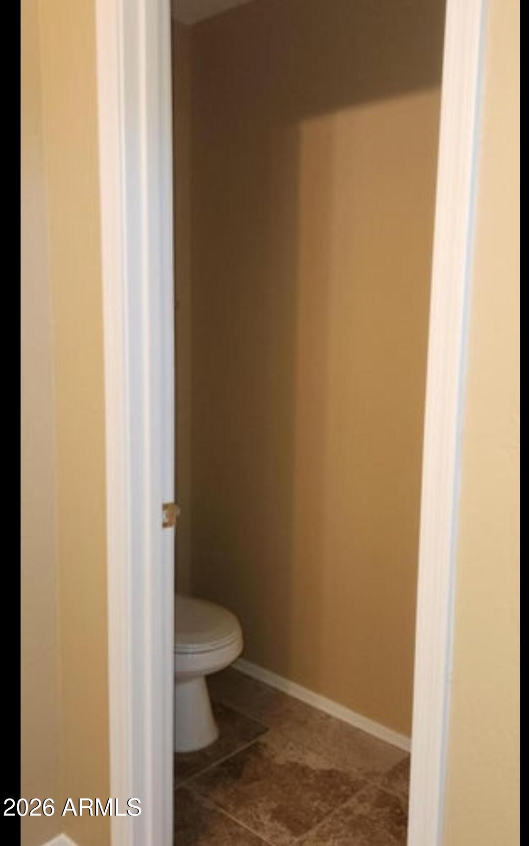 2134 West Pleasant Lane Phoenix, AZ 85041 - Photo 19 of 23 a bathroom with a toilet