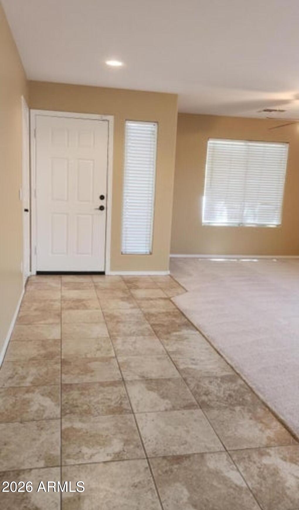 2134 West Pleasant Lane Phoenix, AZ 85041 - Photo 2 of 23 a view of an empty room with a window