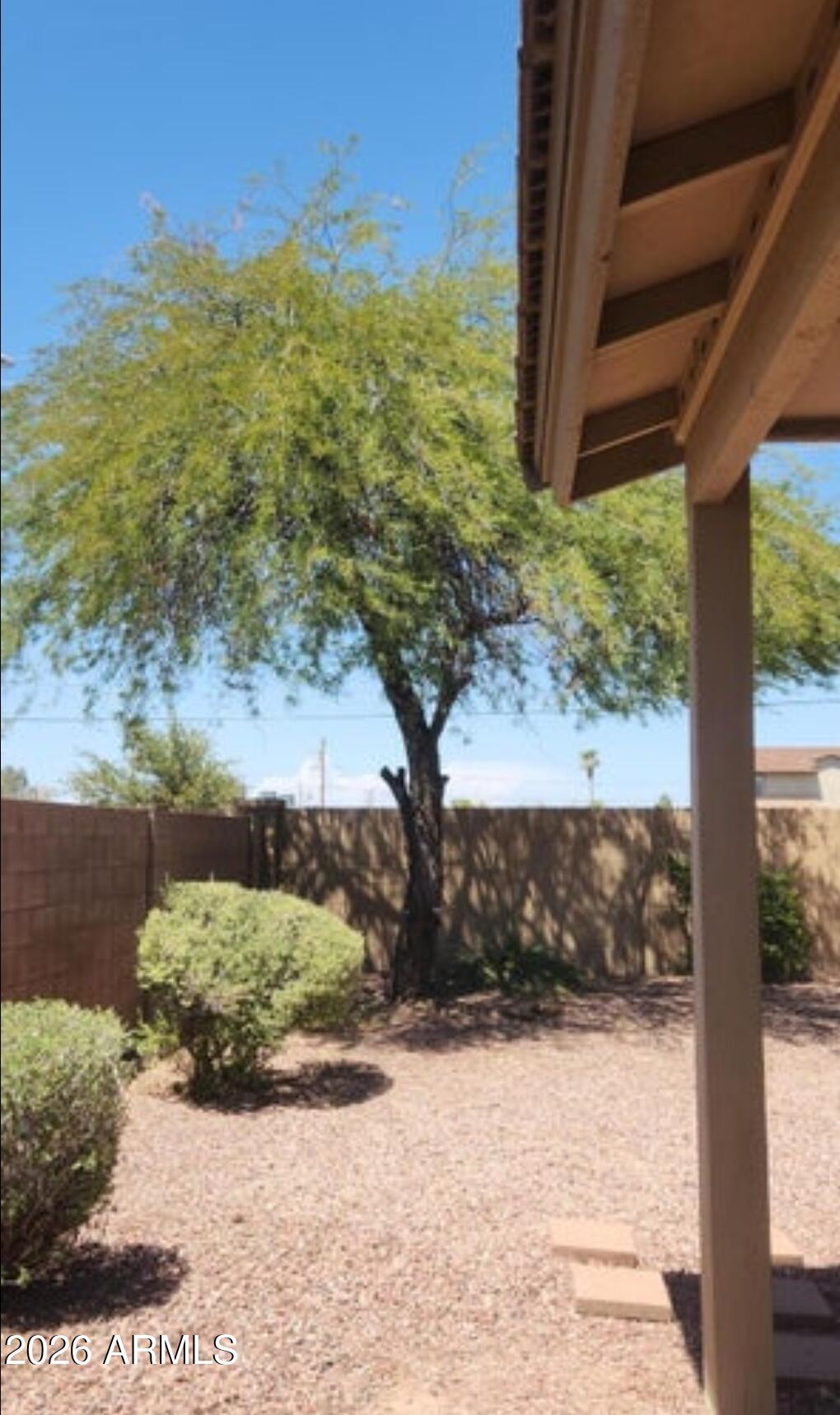 2134 West Pleasant Lane Phoenix, AZ 85041 - Photo 21 of 23 a view of a yard with a tree