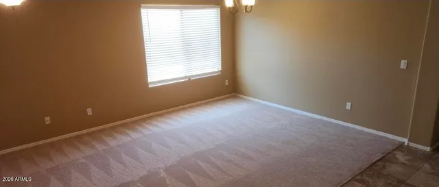 an empty room with a empty space and a window