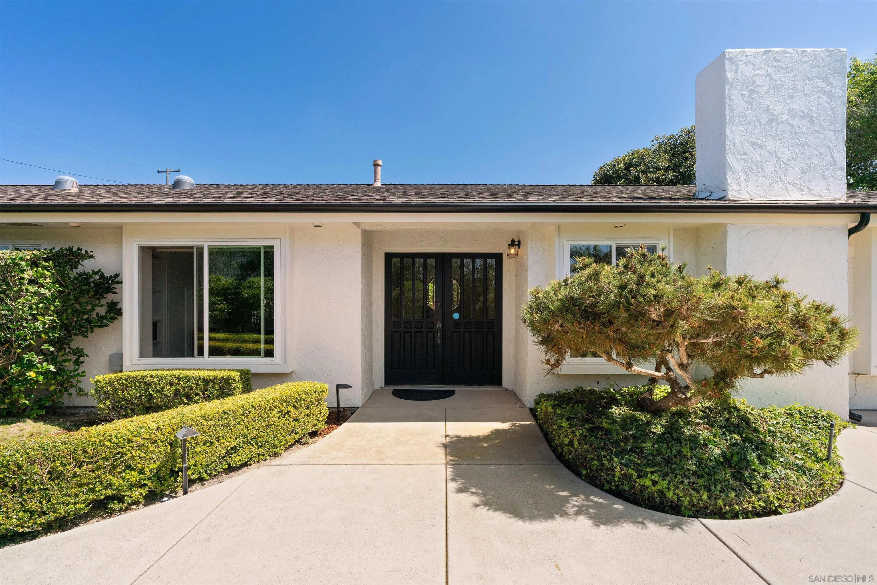 445 Avenida Primavera Del Mar, CA 92014 - Photo 11 of 44 a front view of a house with garden