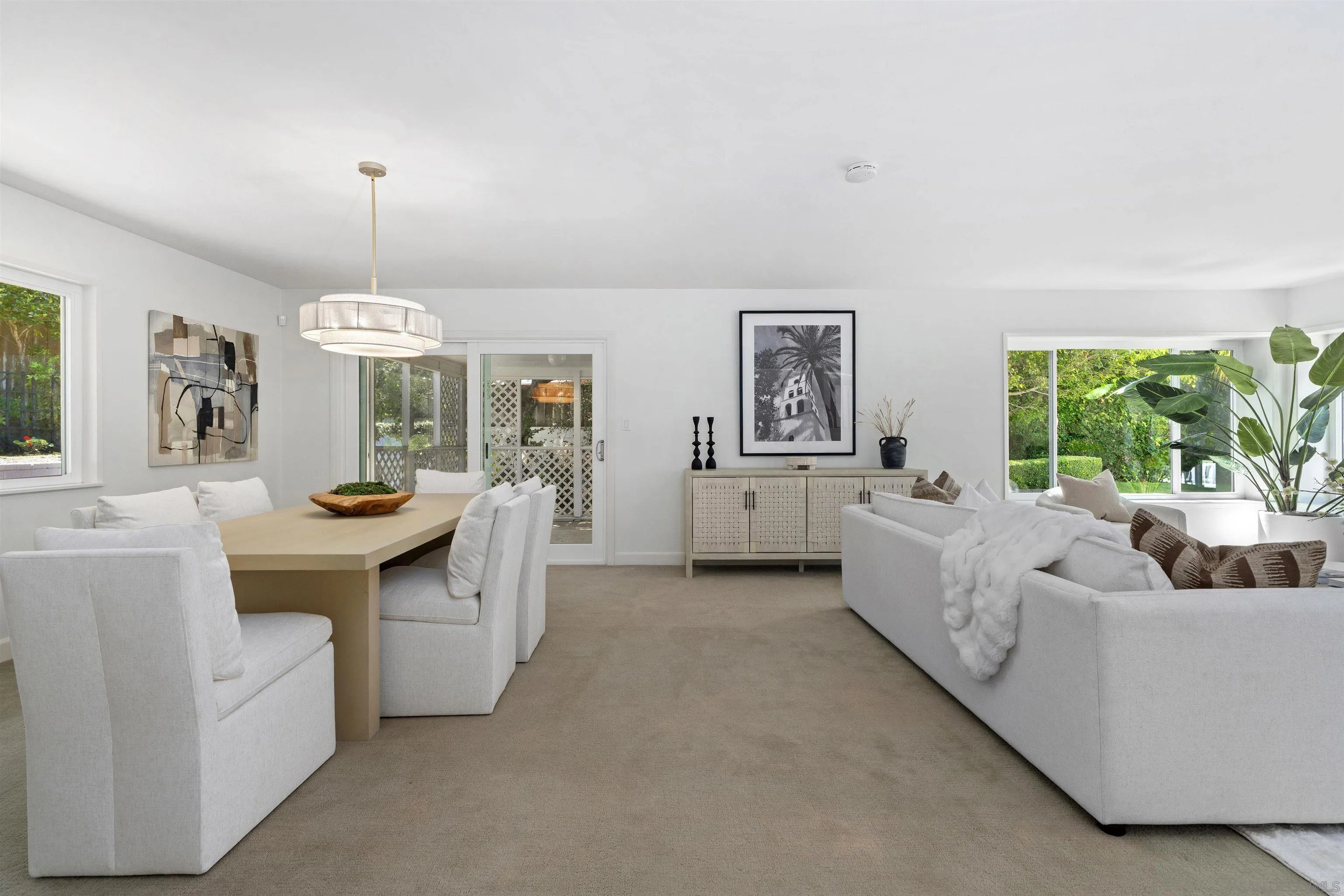 445 Avenida Primavera Del Mar, CA 92014 - Photo 17 of 44 a living room with furniture and a large window
