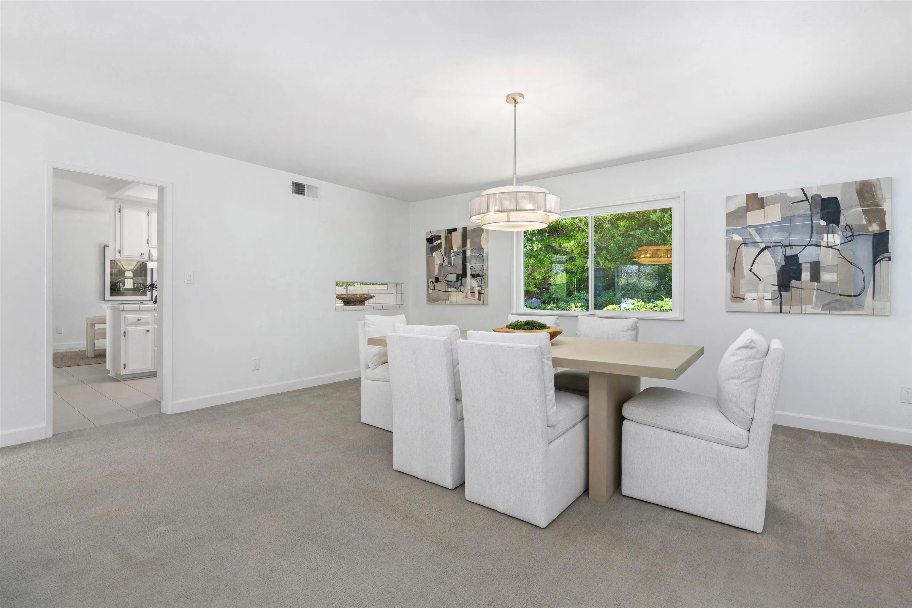 445 Avenida Primavera Del Mar, CA 92014 - Photo 18 of 44 a living room with furniture a chandelier and a window