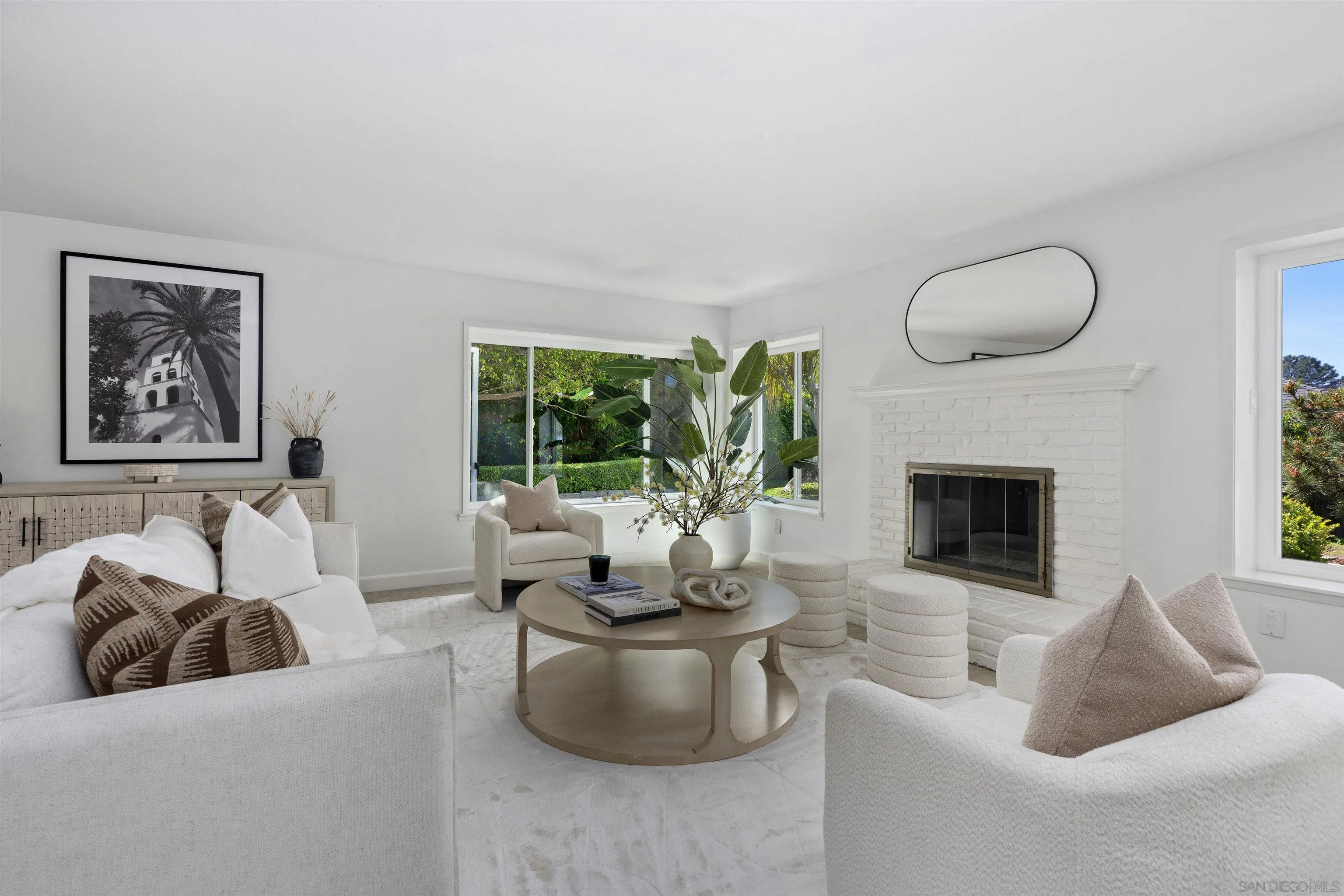 445 Avenida Primavera Del Mar, CA 92014 - Photo 2 of 44 a living room with furniture and a fireplace
