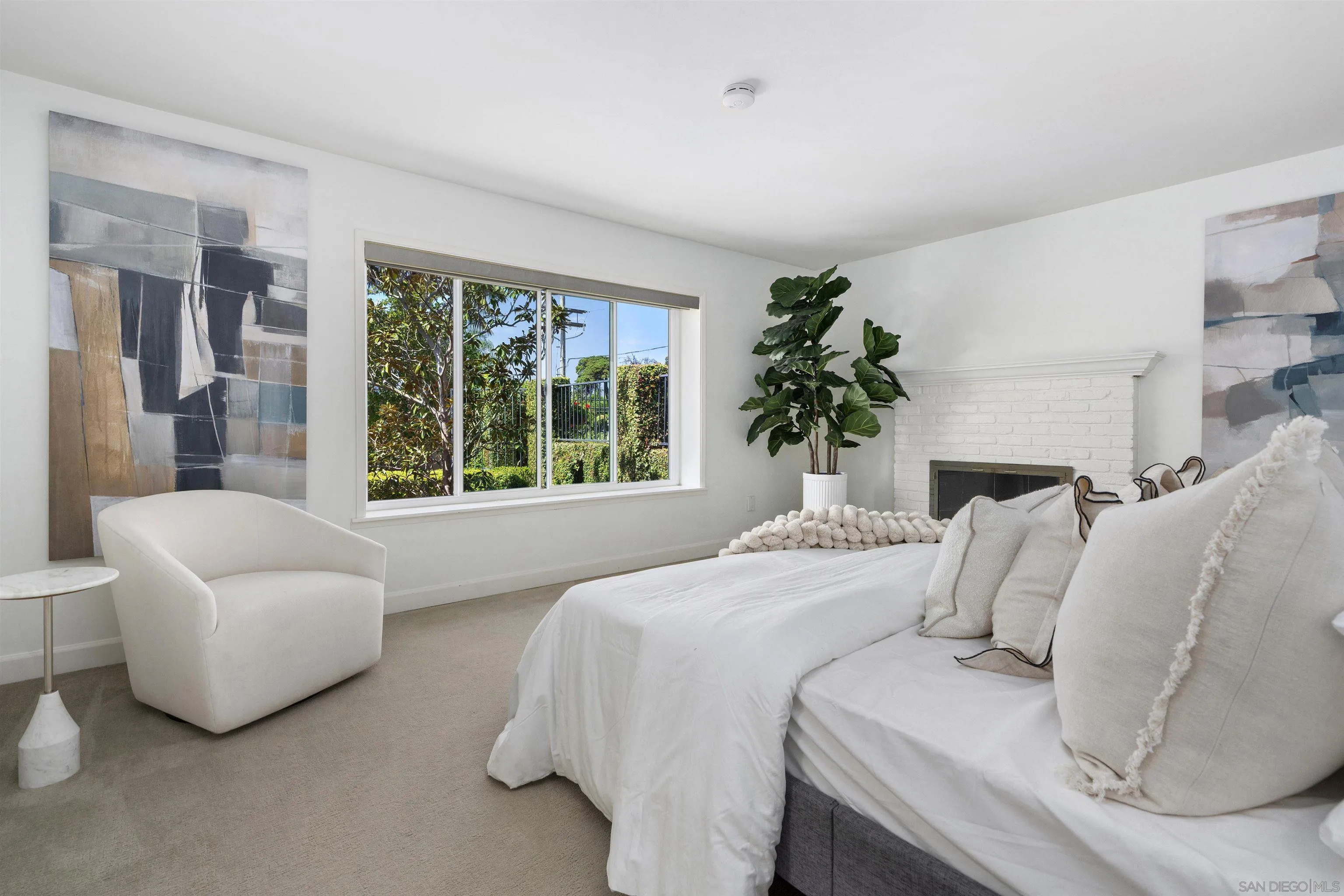 445 Avenida Primavera Del Mar, CA 92014 - Photo 28 of 44 a bedroom with a bed and a large window