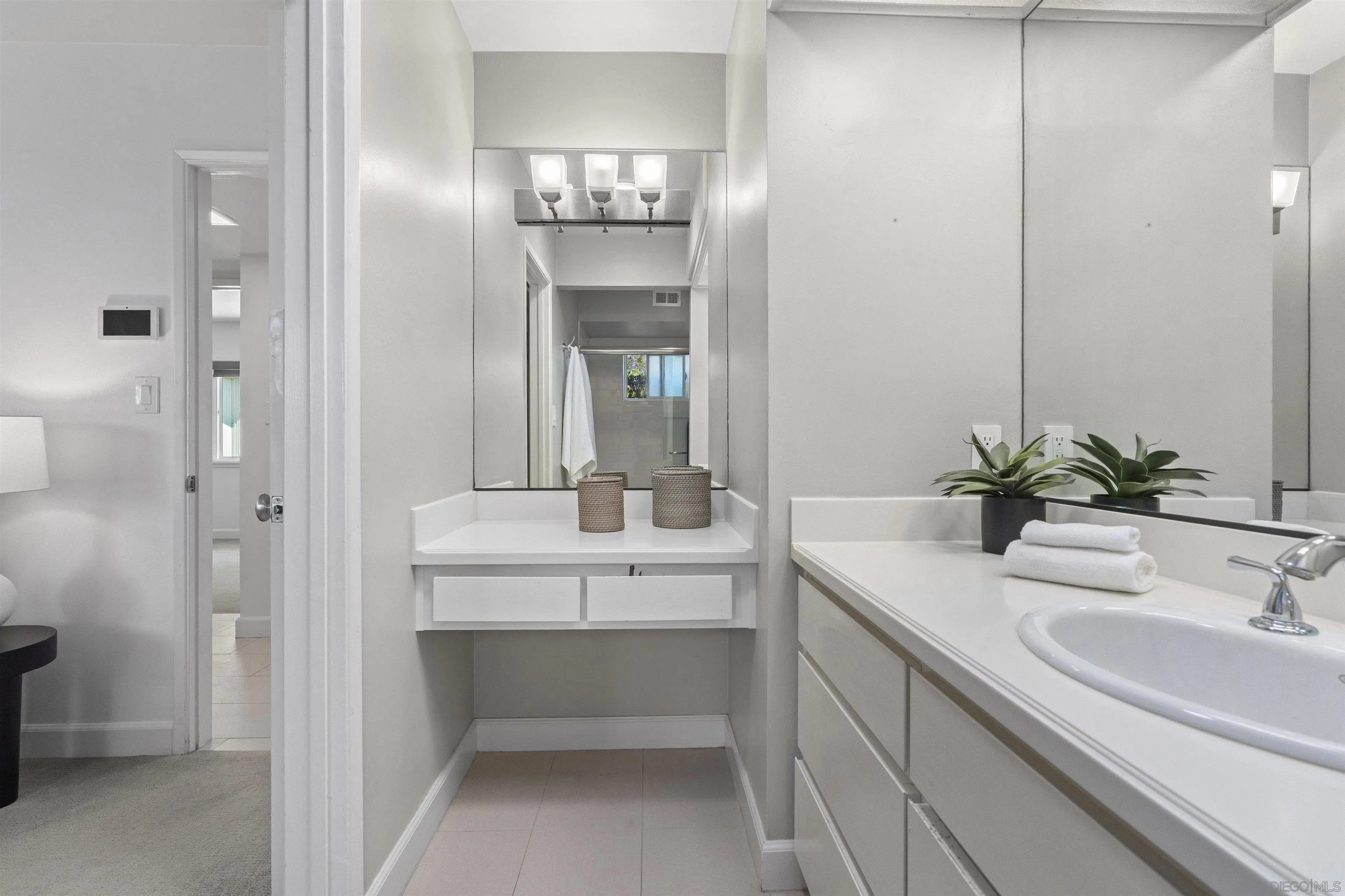 445 Avenida Primavera Del Mar, CA 92014 - Photo 32 of 44 a bathroom with a sink and a mirror