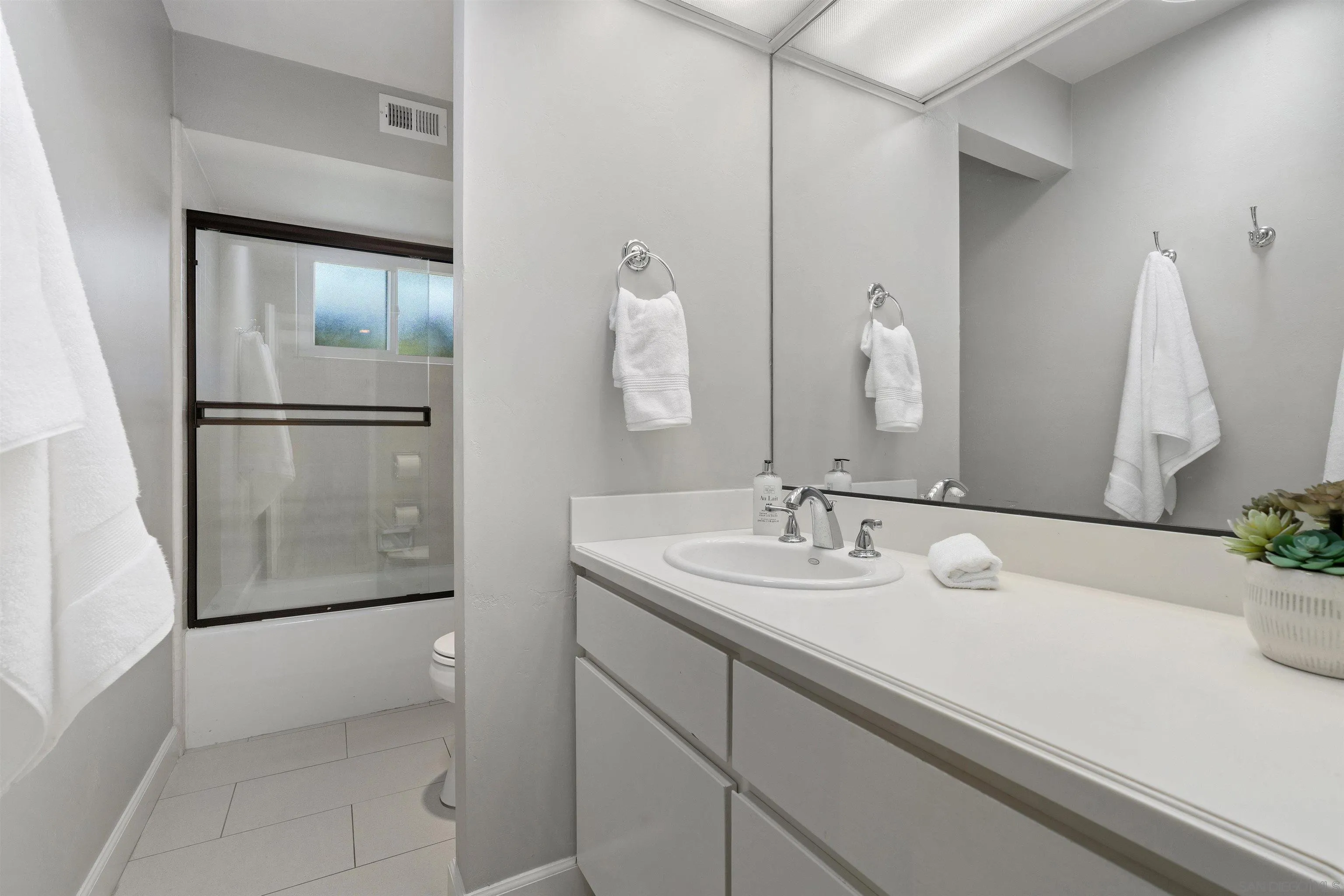 445 Avenida Primavera Del Mar, CA 92014 - Photo 36 of 44 a bathroom with a sink and a mirror