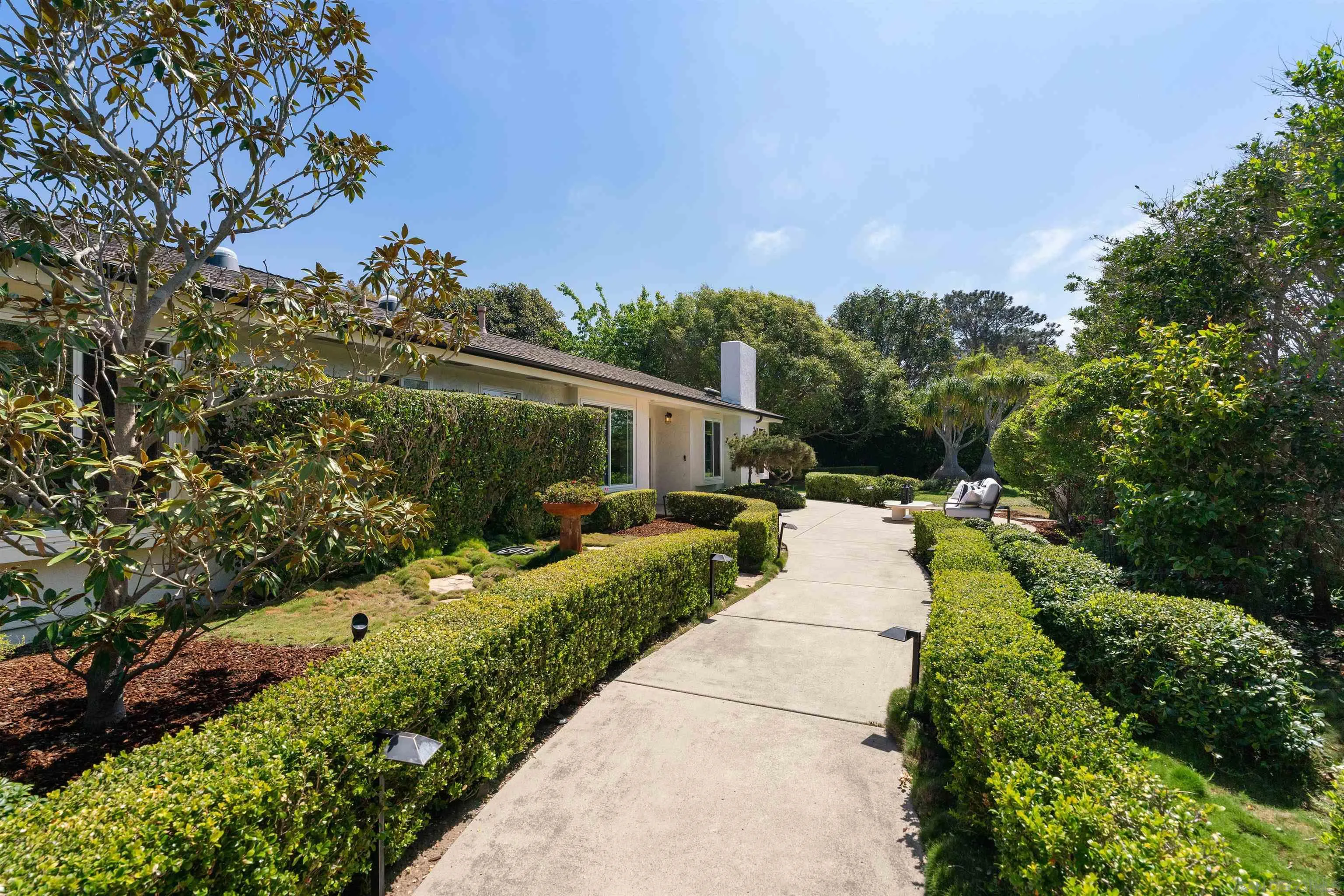 445 Avenida Primavera Del Mar, CA 92014 - Photo 6 of 44 a view of a house with a yard