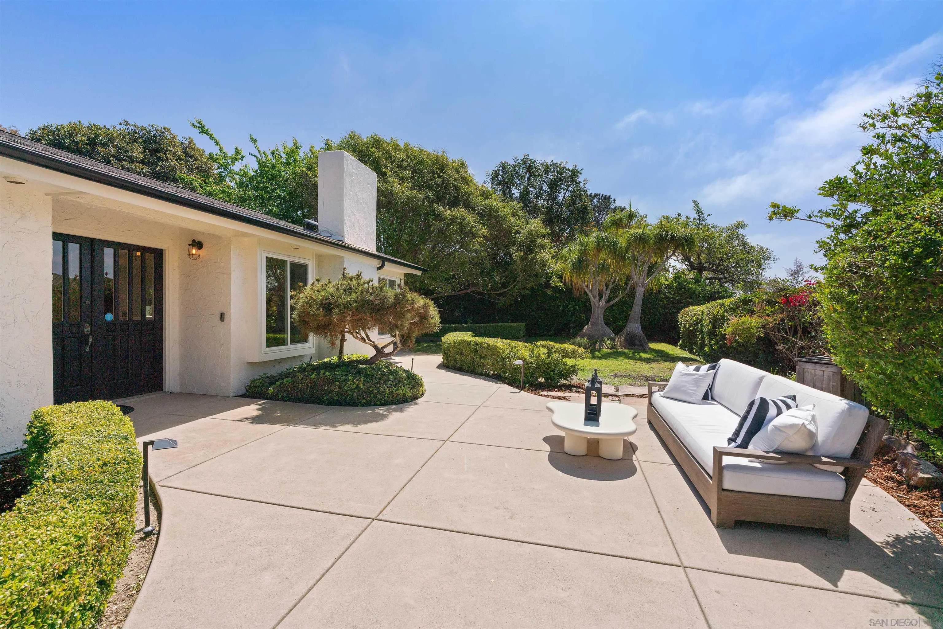 445 Avenida Primavera Del Mar, CA 92014 - Photo 7 of 44 a view of a patio with couches chairs and potted plants