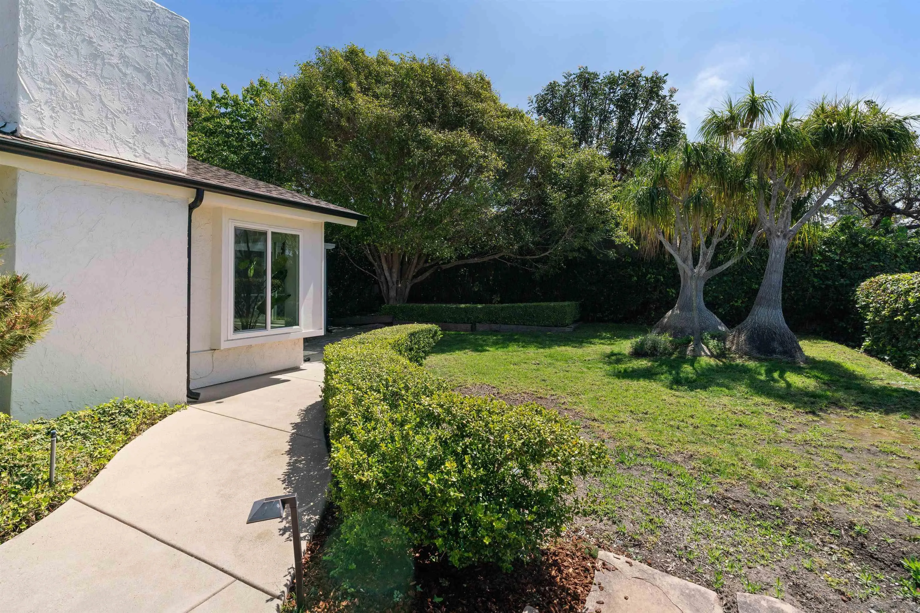 445 Avenida Primavera Del Mar, CA 92014 - Photo 8 of 44 a front view of a house with garden
