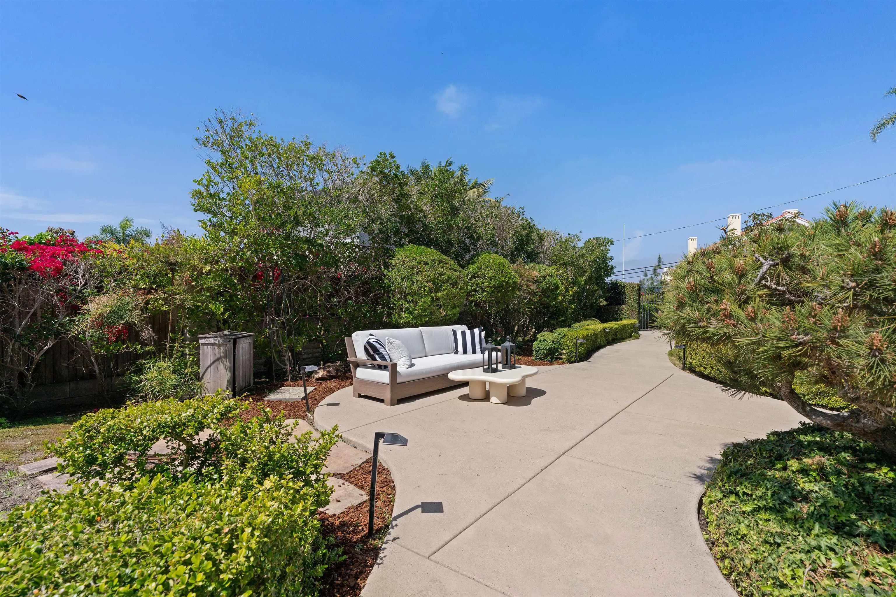 445 Avenida Primavera Del Mar, CA 92014 - Photo 9 of 44 a view of a yard with potted plants and large trees