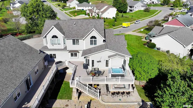 a view of a patio with a table and chairs