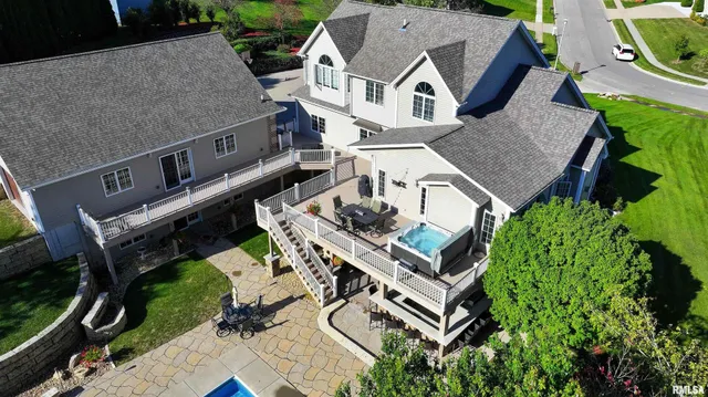 a view of a patio with a table and chairs