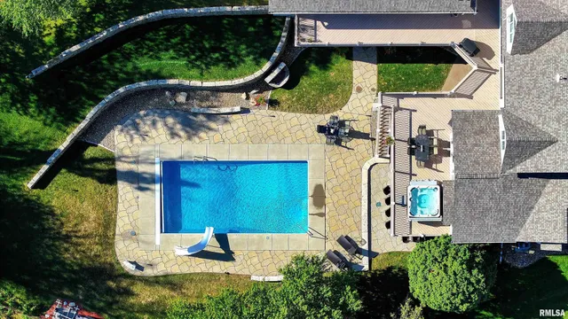 a view of an outdoor dining space with a table and chairs