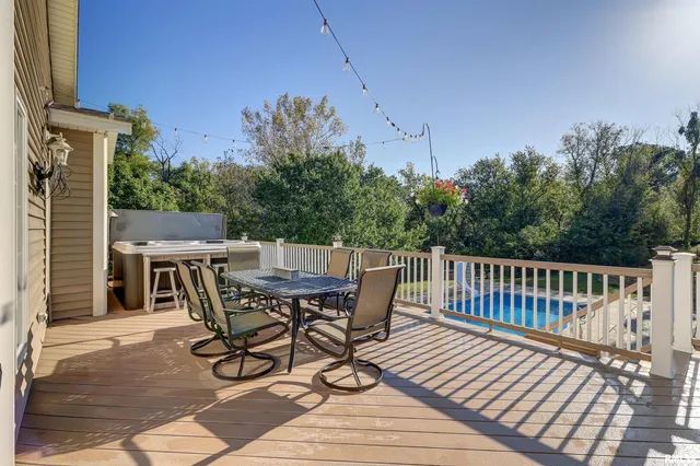 an aerial view of a house with yard swimming pool and outdoor seating