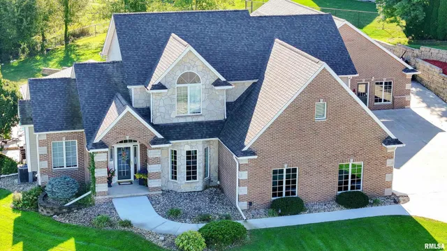 a spacious bedroom with a bed and a dresser