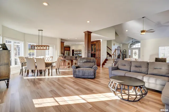 an aerial view of a house with swimming pool garden and outdoor seating