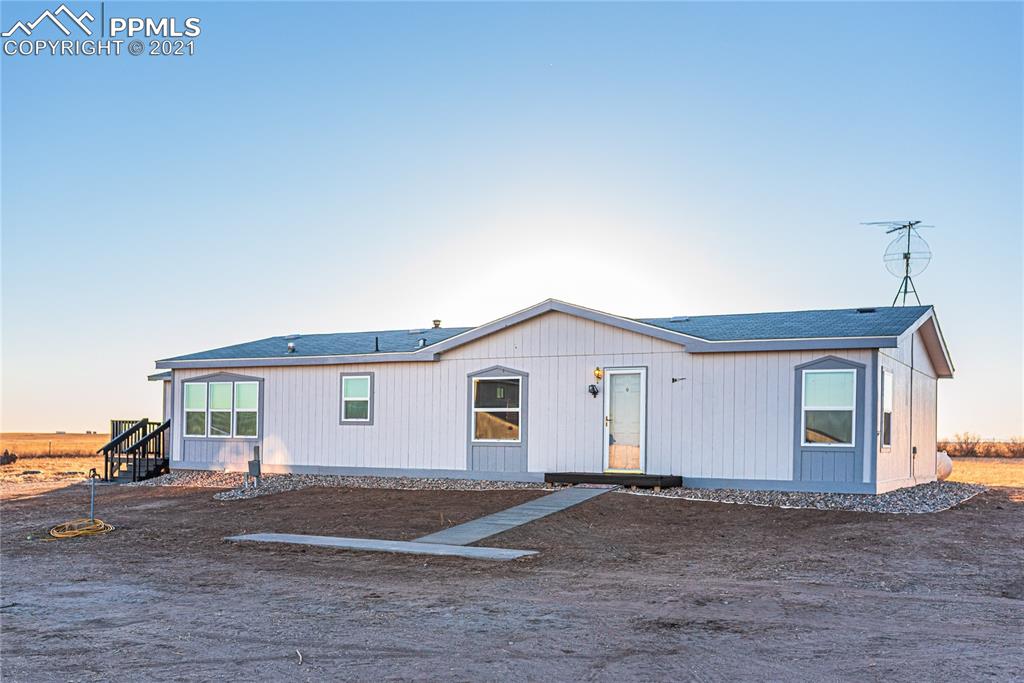1808 County Road South Rush, CO 80833 - Photo 2 of 36 a view of backyard of house