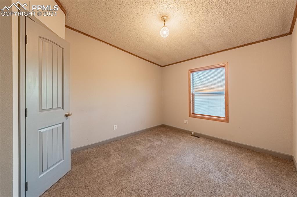 1808 County Road South Rush, CO 80833 - Photo 19 of 36 an empty room with windows and closet