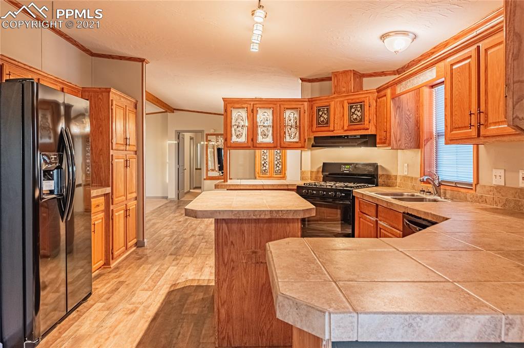 1808 County Road South Rush, CO 80833 - Photo 4 of 36 a kitchen that has a lot of cabinets in it