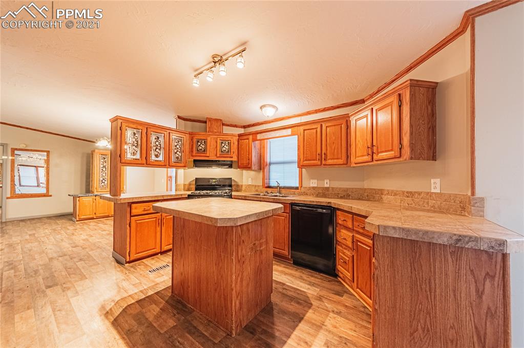 1808 County Road South Rush, CO 80833 - Photo 5 of 36 a kitchen with stainless steel appliances granite countertop a sink stove and refrigerator