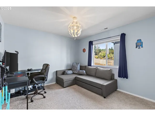 a living room with furniture and a window