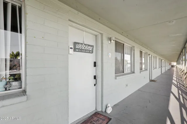 a view of a swimming pool with a patio