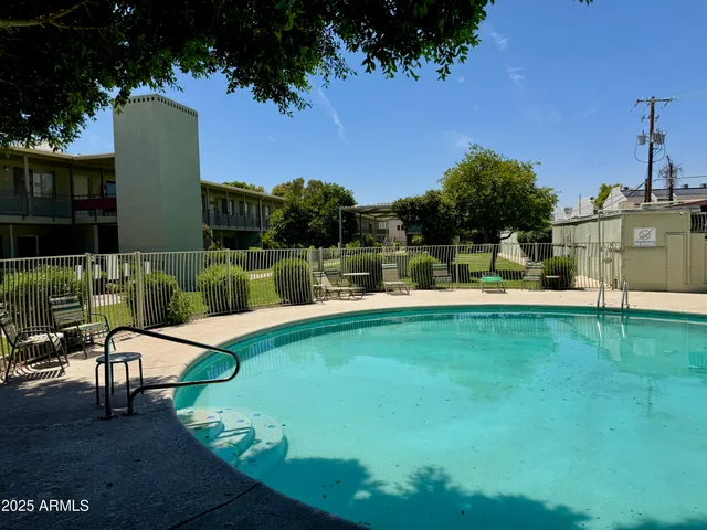 a view of a patio with a table chairs and a table