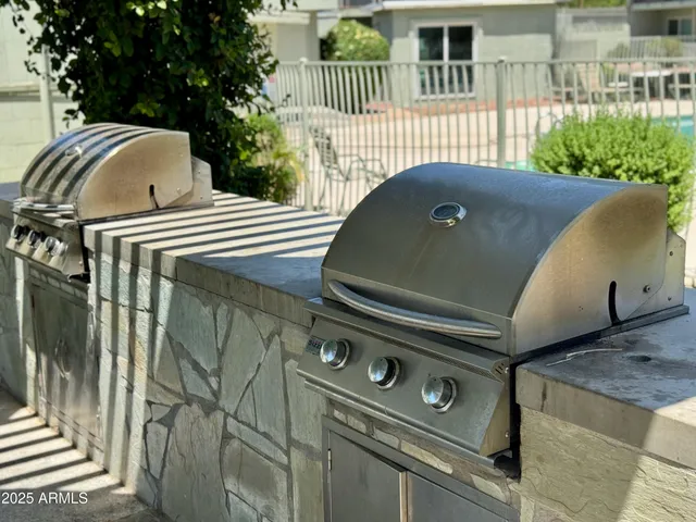 a tree in front of a white house