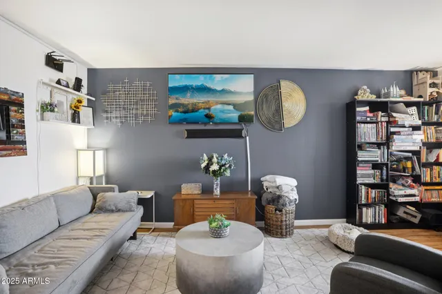 a bathroom with a granite countertop sink a mirror and a toilet