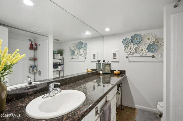 a bed room with a bed and a tv