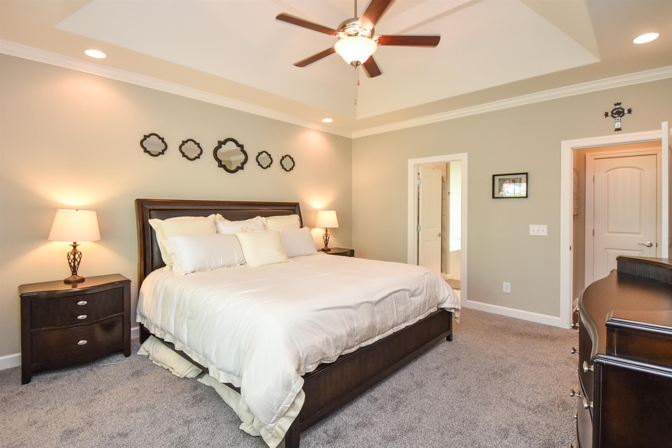 310 Independence Street Springfield, TN 37172 - Photo 20 of 29 a bedroom with a bed a lamp and a dresser