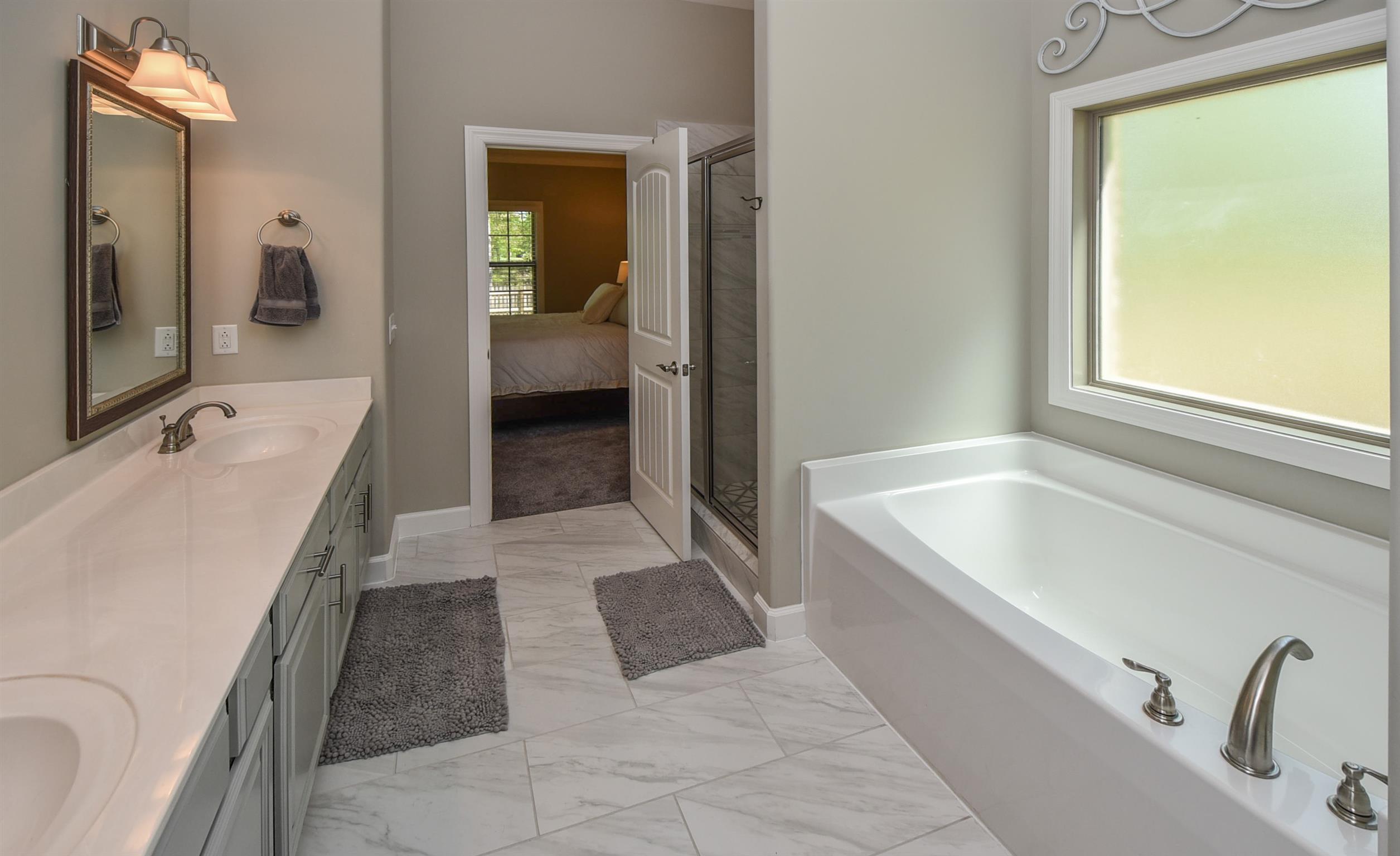 310 Independence Street Springfield, TN 37172 - Photo 23 of 29 a bathroom with a tub sink and mirror