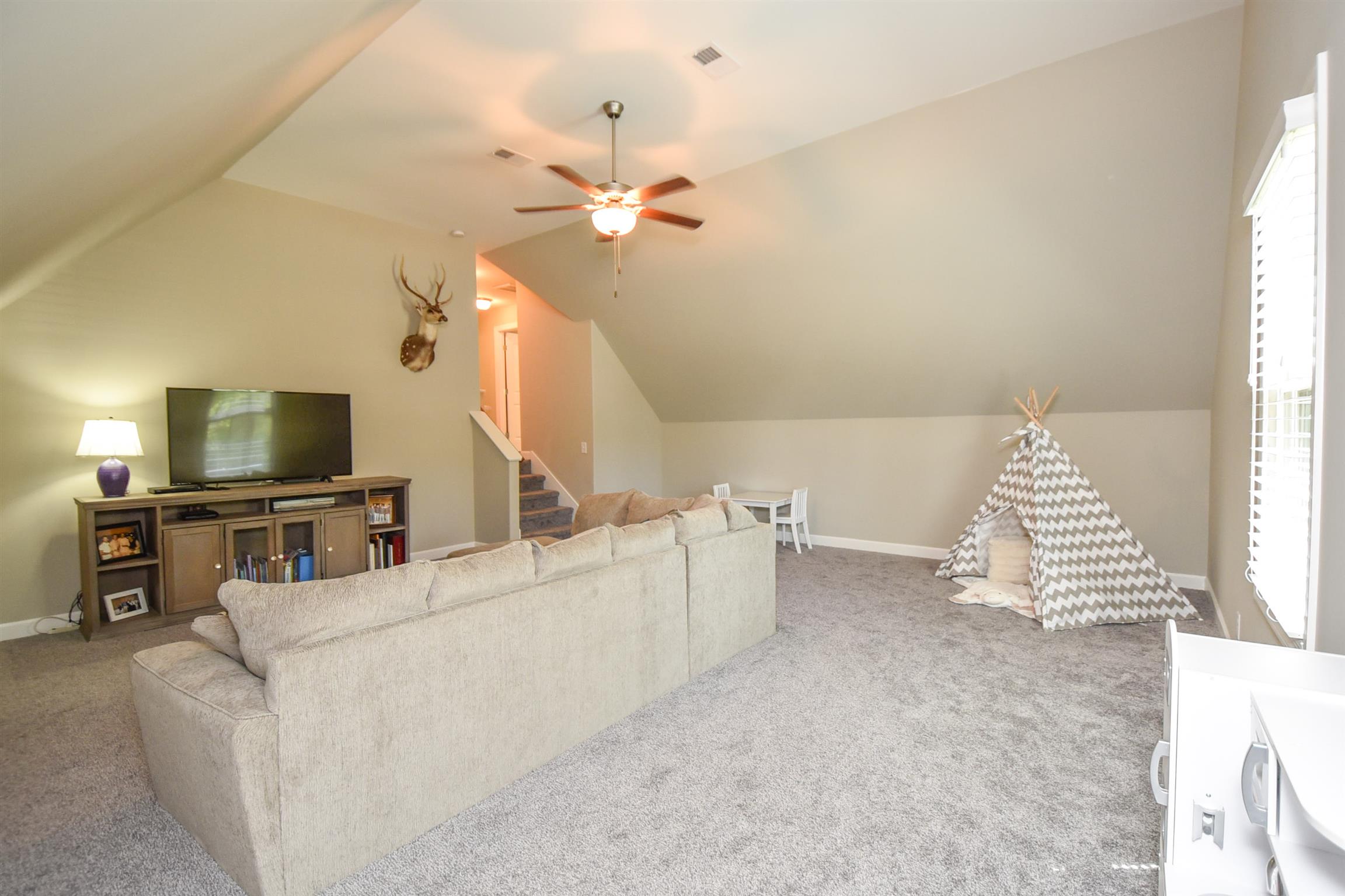 310 Independence Street Springfield, TN 37172 - Photo 28 of 29 a living room with furniture and a flat screen tv