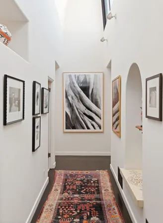 a bedroom with a bed and glass window