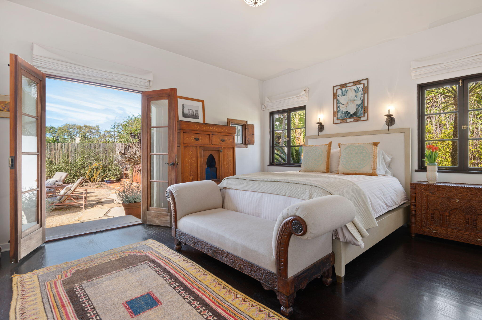 127 Hermosillo Road Montecito, CA 93108 - Photo 15 of 37 a bedroom with a bed and glass window