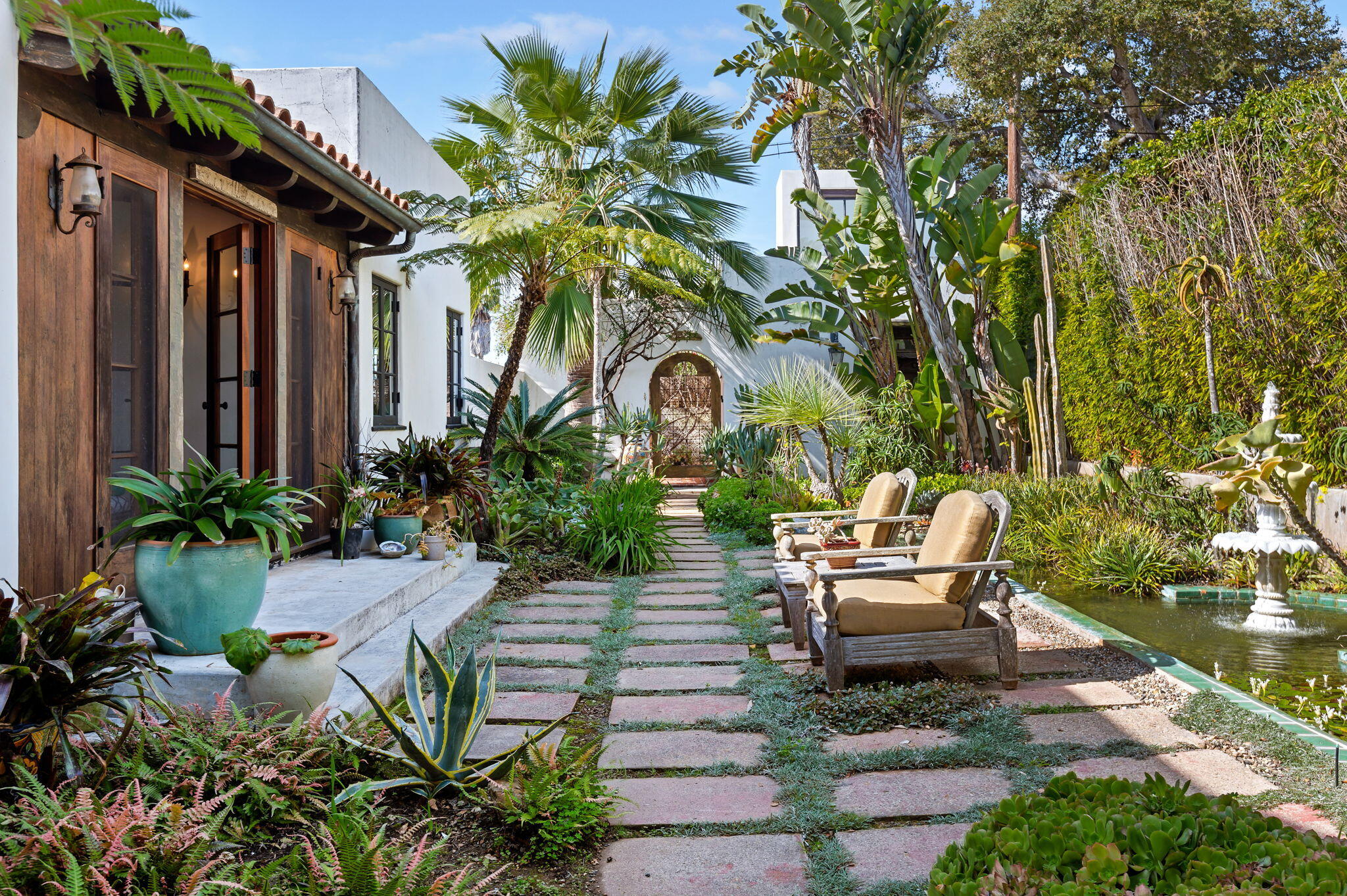 127 Hermosillo Road Montecito, CA 93108 - Photo 29 of 37 a front view of a house with garden and sitting area