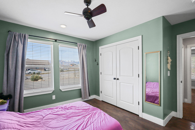 1588 West Rim Rock Drive Stockton, UT 84071 - Photo 23 of 61 Room featuring rich wood-finish flooring and a ceiling fan with integrated lighting