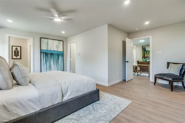 a bedroom with a bed and a chair