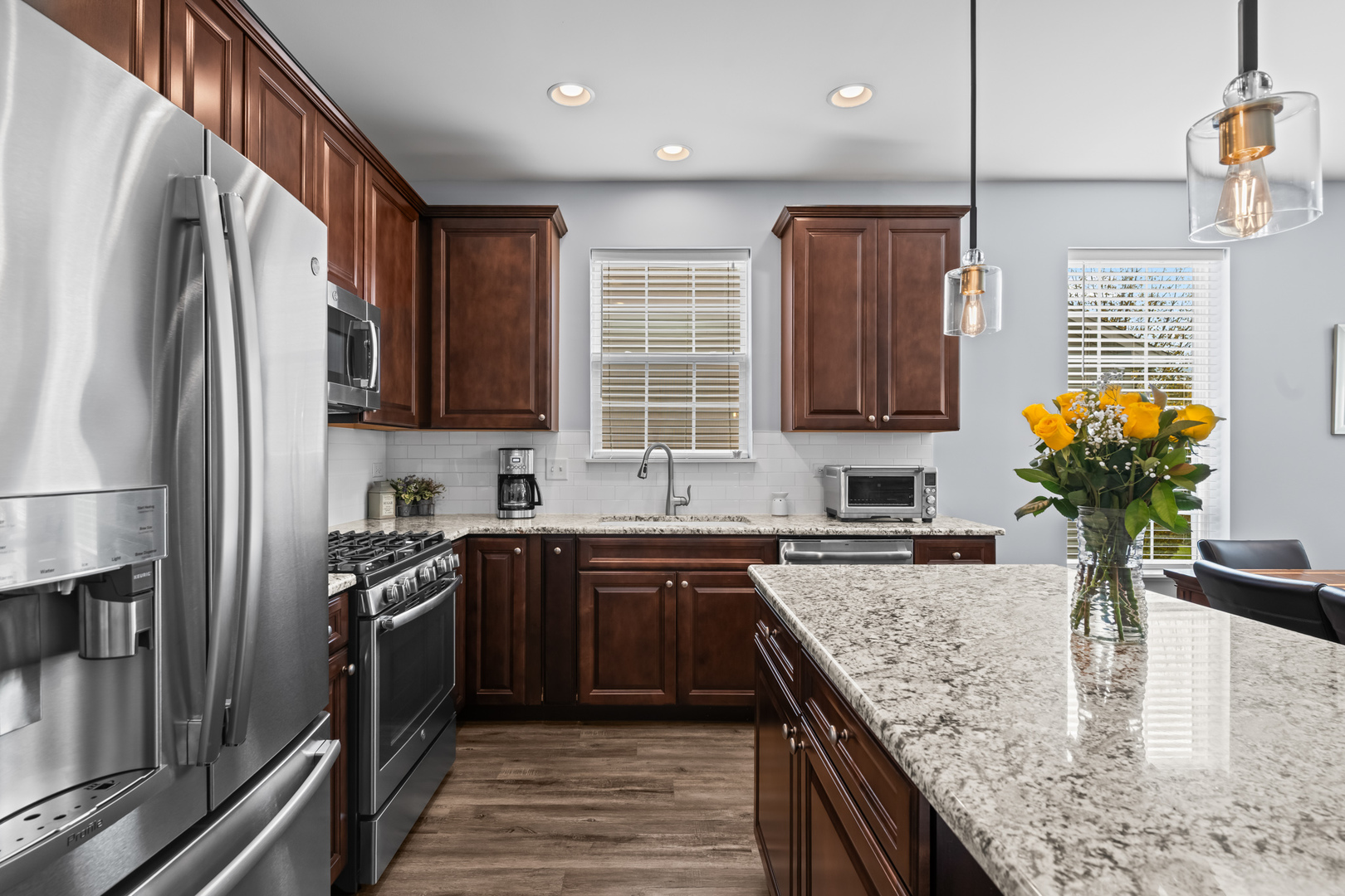 460 Mahogany Drive Algonquin, IL 60102 - Photo 9 of 29 a kitchen with stainless steel appliances granite countertop sink stove refrigerator and cabinets