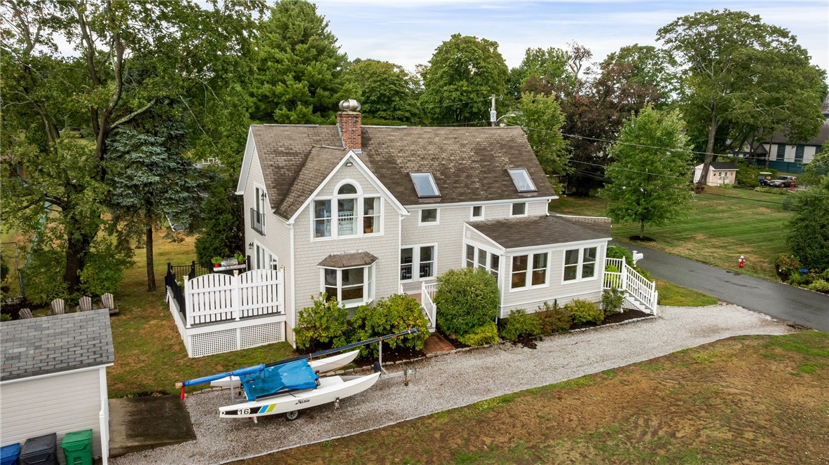 41 8th Avenue Warwick, RI 02886 - Photo 5 of 49 showing south facing deck off family room; deck off family room; and shed