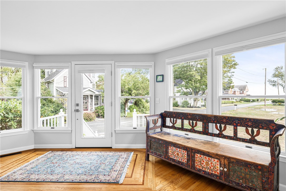 41 8th Avenue Warwick, RI 02886 - Photo 7 of 49 side to side front living room; hard wood floors; windows on two walls (east and south)