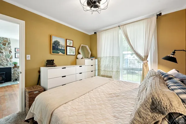 a workspace with wooden floor and a window