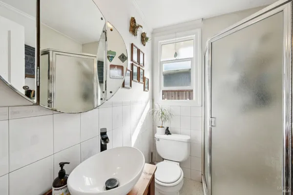 a view of a porch with potted plants